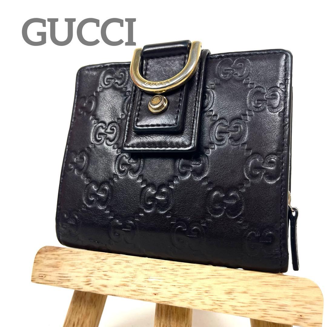 グッチ　二つ折り財布　アビー　シマレザー　ラウンドファスナー　ロゴ　エンボス