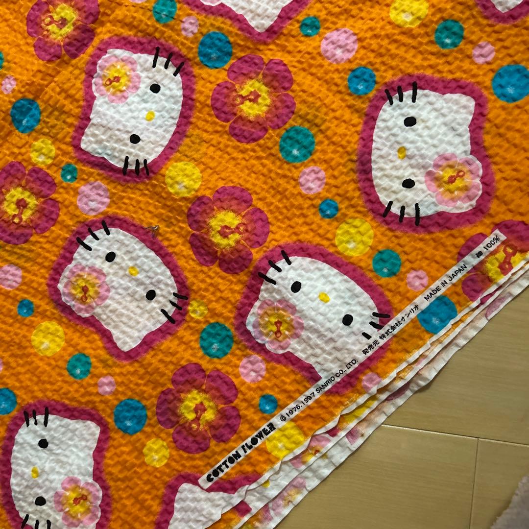 キティ　ちりめん　カオハナ　オレンジ　生地　ハギレ