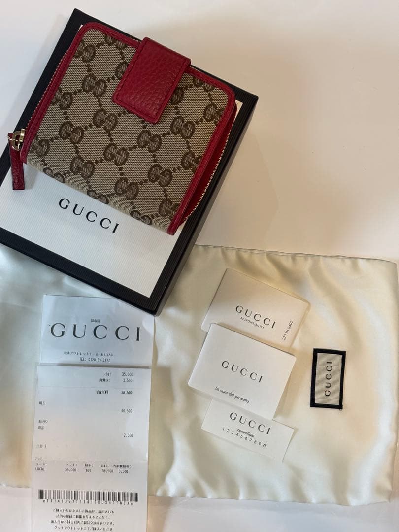 GUCCI GGパターン 二つ折り財布コンパクトウォレットラウンドジップ